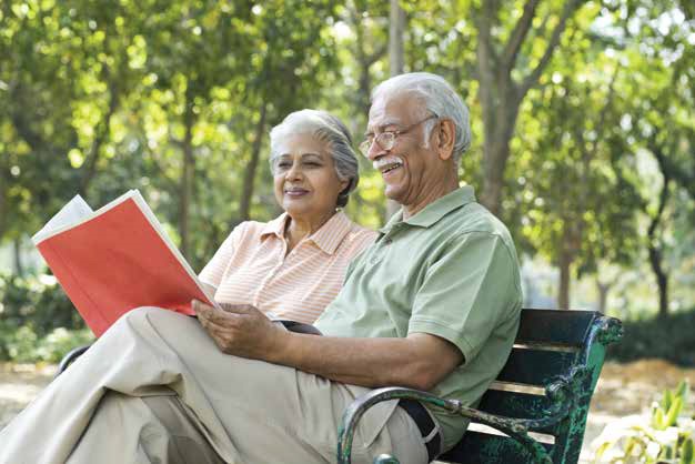 Senior parents in India supported by their NRI child